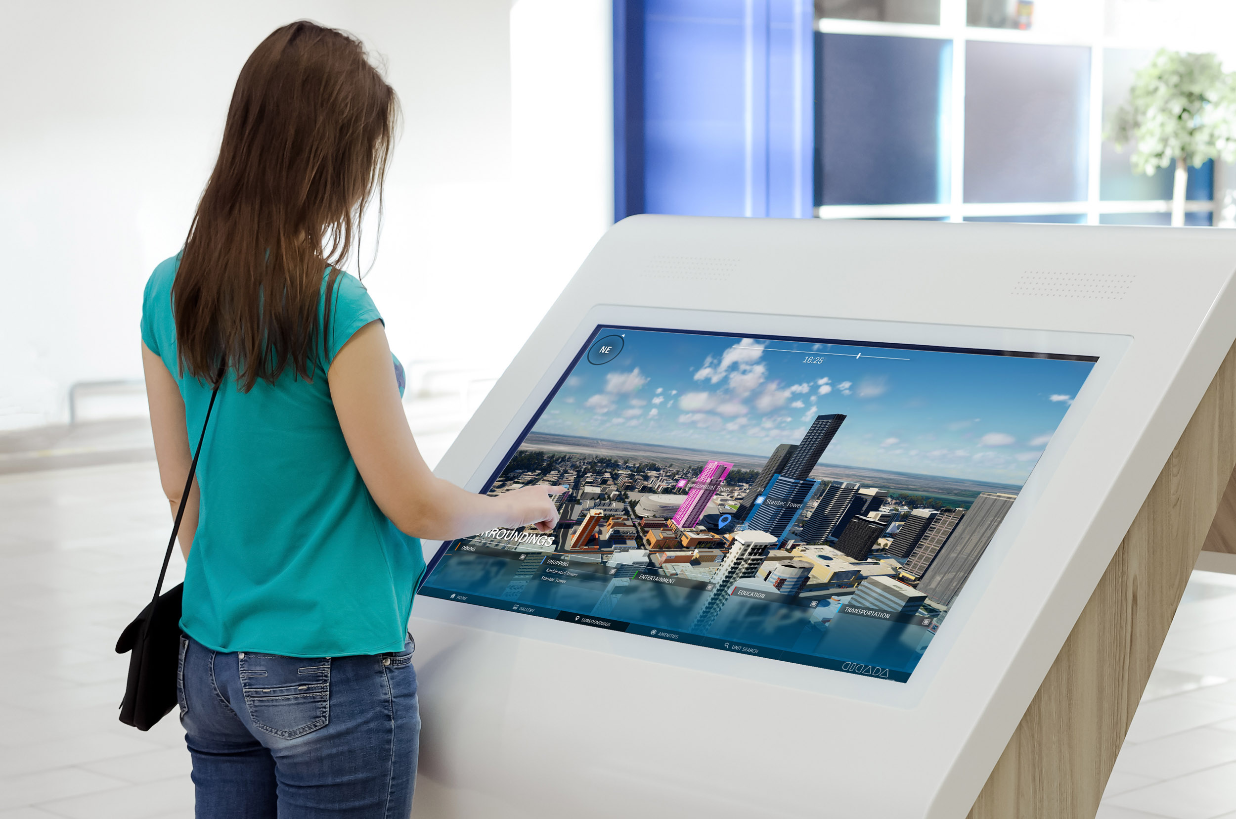 Woman is using a blank touch screen of interactive information stand in the supermarket.